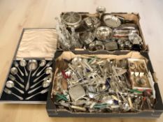 A large quantity of EPNS wares including assorted cutlery, cruet, coasters, napkin rings, bowls,