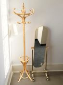 A brass cheval mirror and a contemporary bentwood hat and coat stand.