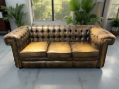 A contemporary Chesterfield three seater club settee,