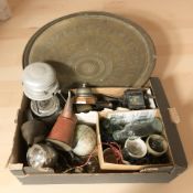 An Islamic engraved brass charger, antique glass bottles, oil lamp, metal wares, vintage tin, globe,
