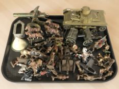 A tin plate model of a tank, together with a group of die cast field guns, painted soldiers, etc.