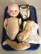 An Armand Marseille bisque headed jointed doll stamped 'Germany, 351./4.K.'.