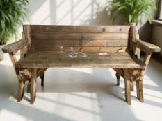 A pine garden bench with folding back rest, width 152 cm.