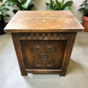 A carved oak box, width 45 cm.