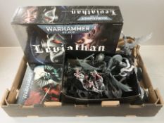 A group of Warhammer 40K miniatures and collectibles.