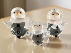 Three Swarovski crystal snowmen figures, tallest 5.5 cm.