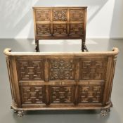 A carved and panelled oak 4' 6