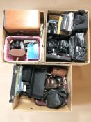 A quantity of vintage cameras, video camera, pair of binoculars, vintage style radio.
