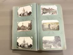 An album of 20th century postcards, some photographic views of London, continental river scenes,