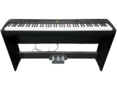 A Yamaha digital piano P-85, with manual and lead.