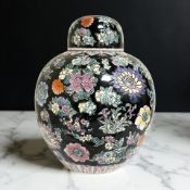 A 20th century Chinese famille noire ginger jar and cover,