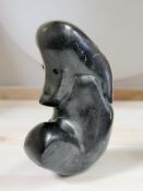 A contemporary Zimbabwean Shona polished stone sculpture, height 33 cm.