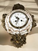 A continental tin and gilt metal mounted wall clock, height 37 cm.