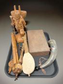 An Eastern heavily carved wooden table box, together with a group of wooden musical instruments,
