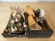 A group of wooden animal ornaments including a large carved statue of an owl,