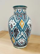 An Iznik style glazed terracotta vase, height 34 cm.