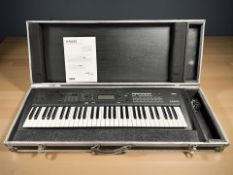 A Korg Kross 2-61 synthesizer work station, in flight case with power lead and instruction manual.