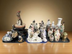 A large quantity of reproduction Oriental porcelain and earthenware figures, vase,