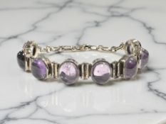 An Ola Gorie silver and cabochon amethyst bracelet, length 18cm, boxed.
