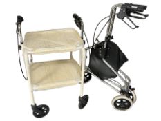 A folding mobility walking aid and a trolley