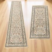A contemporary runner, 80 cm x 330 cm, together with the matching rug, 79 cm x 152 cm.