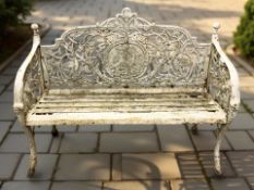 A Victorian style painted cast iron garden bench, width 130 cm.