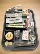 A group of wristwatches, onyx table lighter, desk punch, Parker pen, compact, playing cards, etc.