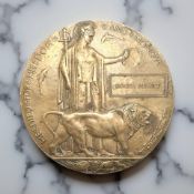 A World War I bronze death penny, named to Roger Hewitt.