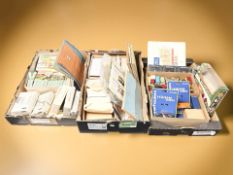A large quantity of cigarette cards in packs, albums and loose, various postcards, stamp albums,