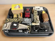 A group of die cast classic cars, military vehicles,