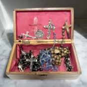 A Jerusalem olive wood trinket box containing rosary beads,