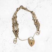A 9ct gold padlock bracelet CONDITION REPORT: 10.