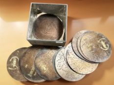 A tin containing a quantity of Polyphon discs.