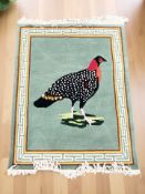 A Chinese woolen rug depicting a pheasant,