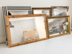A group of reproduction gilt and silvered mirrors, a metal framed mirror and a pine mirror,