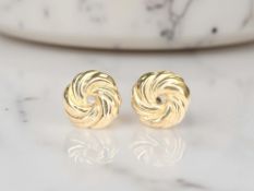 A pair of 9ct gold swirl-patterned ear studs CONDITION REPORT: 0.