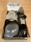 A reenactment German M35 helmet, together with a knight's steel helmet,