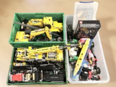 A collection of Lego-style blocks including cranes, excavator,