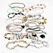 A collection of costume necklaces, some with silver clasps, including cultured pearls,
