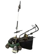 A petrol lawn mower and Titan 25cc multi tool with chain saw,