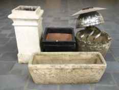 A weathered concrete rectangular garden planter, a glazed earthenware square planter,