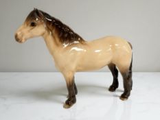 A Beswick figure : Highland Pony 'Mackionneach', colour dun, gloss, height 17.5 cm.