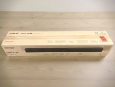 A boxed Denon DHT-S218 Dolby Atmos sound bar,