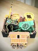 A group of painted wooden gypsy caravan models and a small painted cracket.