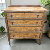 An Edwardian oak four drawer chest,