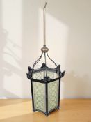 A 20th century painted metal hexagonal ceiling light shade with painted glass panels,