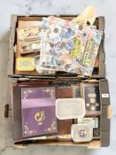 A large quantity of coins, various commemorative issues, two albums of world bank notes,