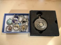 A group of decorative dress rings, enamelled badges, bracelet,