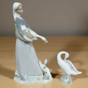 A Lladro figure of a lady with a puppy at her feet No.