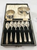A hallmarked silver napkin ring, another stamped '0925', and a cased set of EPNS teaspoons.